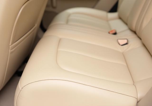 The same SUV leather seat now perfectly clean, matte, and looking new.